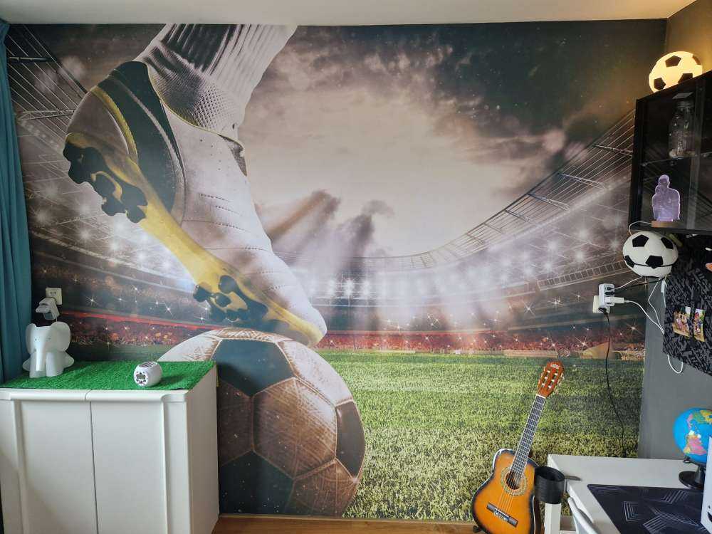 Joueur de football dans un stade