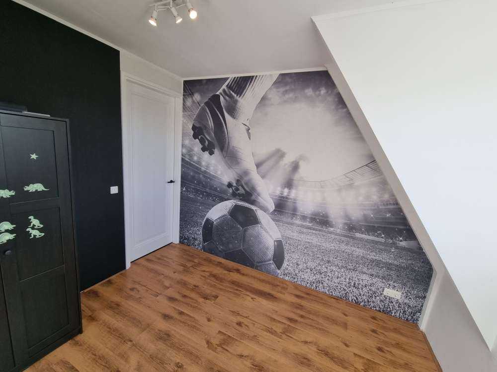 Joueur de football dans un stade
