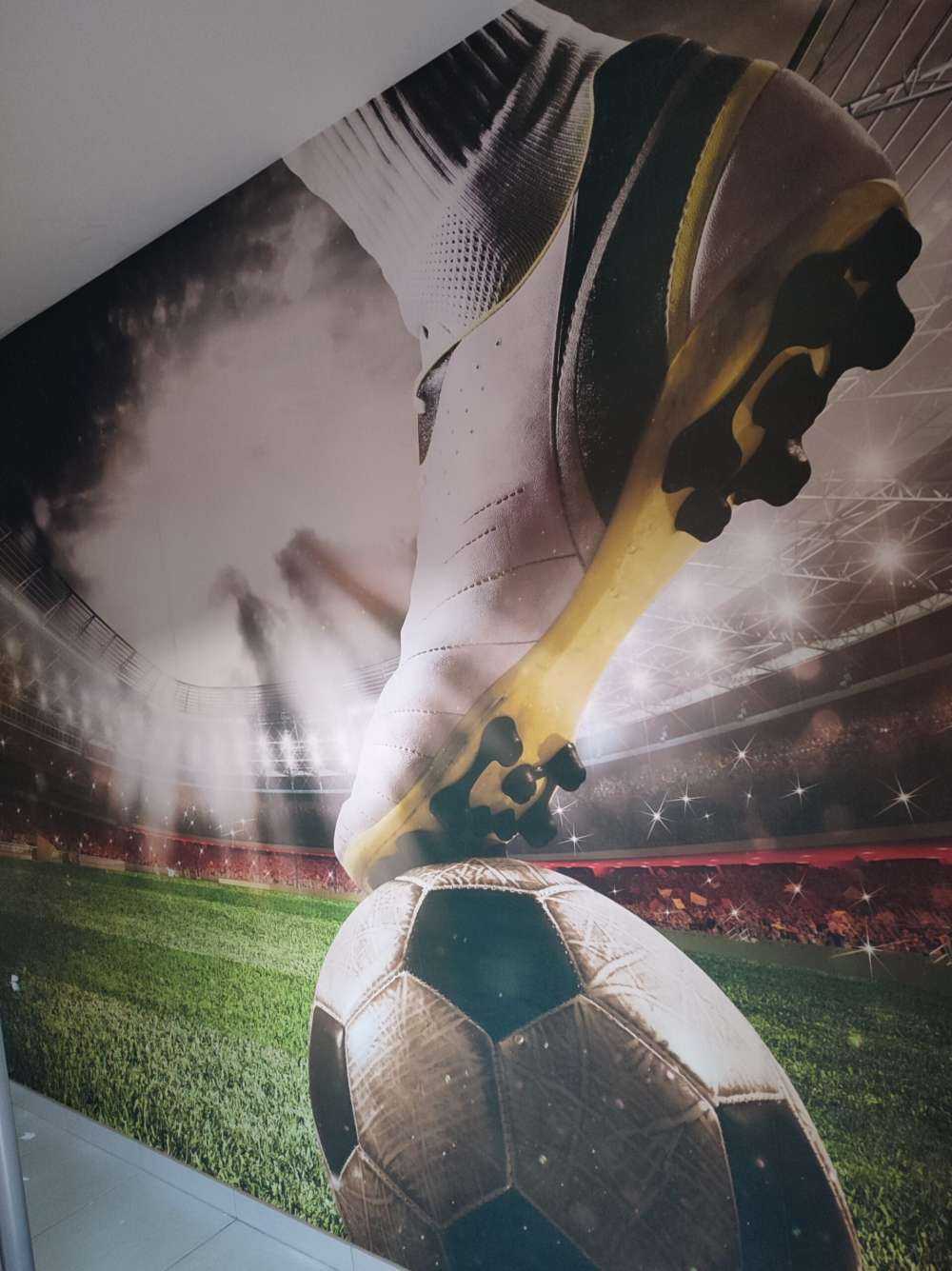 Joueur de football dans un stade