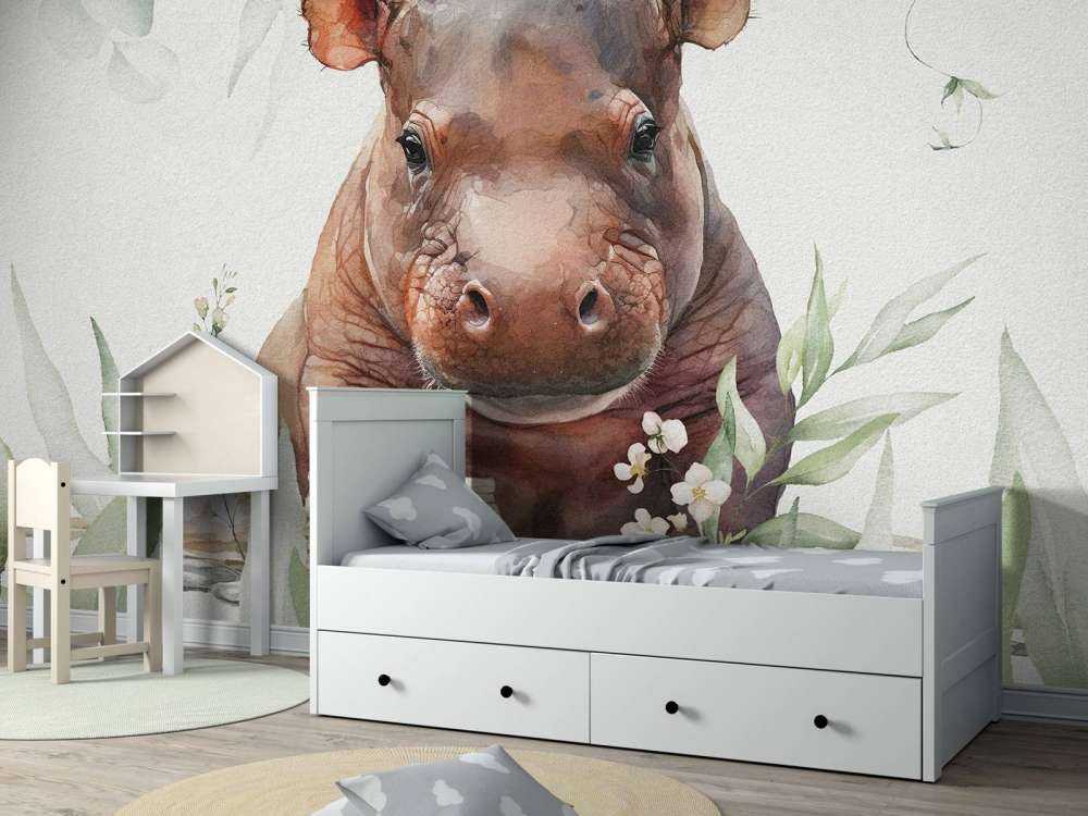 Bébé hippopotame dans les feuilles