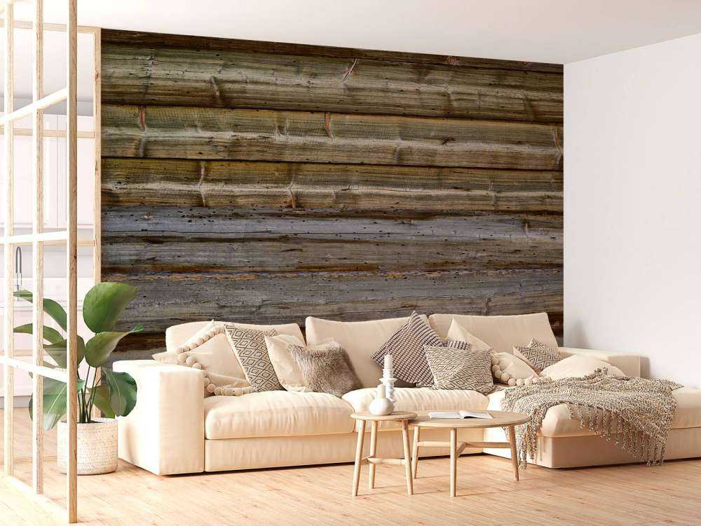 Bois vieilli sur un mur de pierre