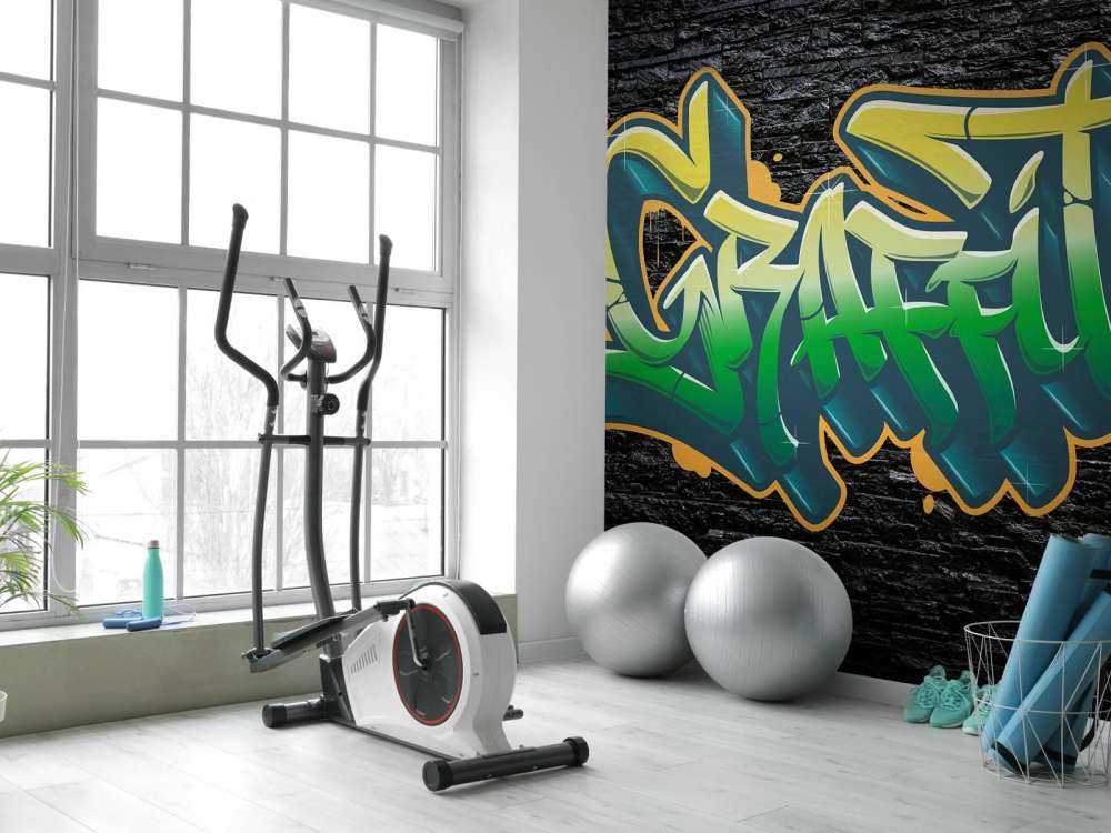 Graffiti sur un mur de briques noires