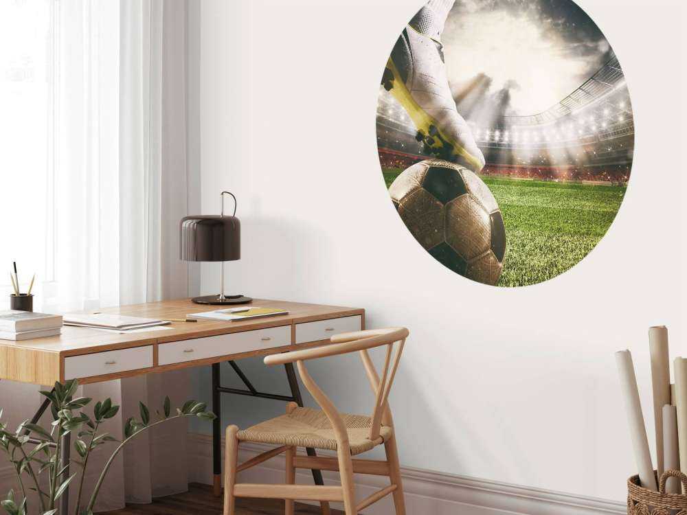 Joueur de football dans un stade