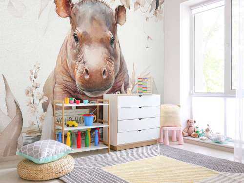 Bébé hippopotame dans les feuilles taupe