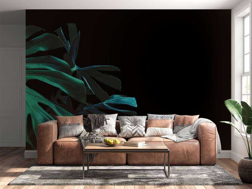 Feuilles tropicales sur fond noir