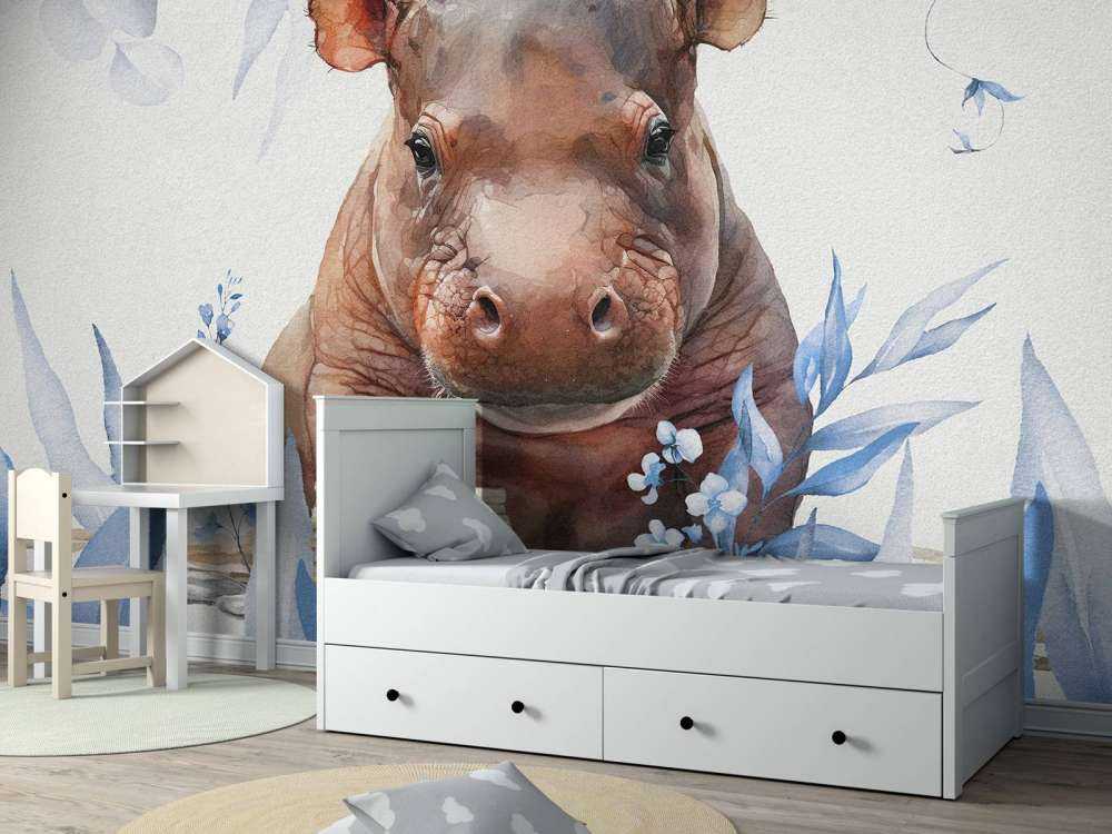 Bébé hippopotame dans les feuilles bleu